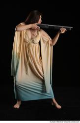 Woman Adult Average White Standing poses Casual Fighting with shotgun